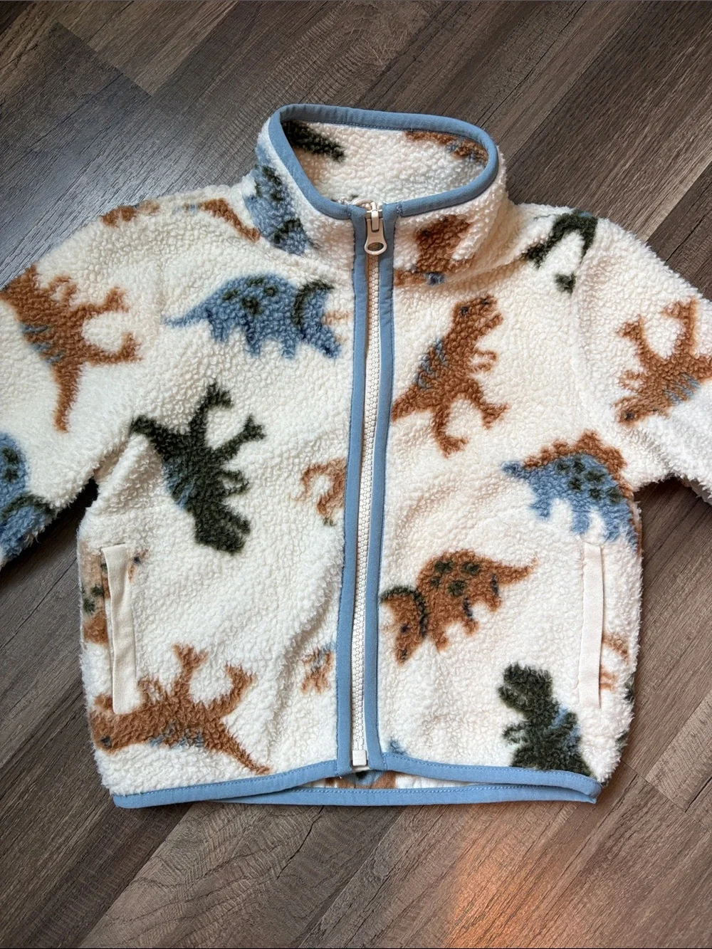 The Children's Place Cream Sherpa Zip Jacket with Blue, Brown & Green Dinosaurs